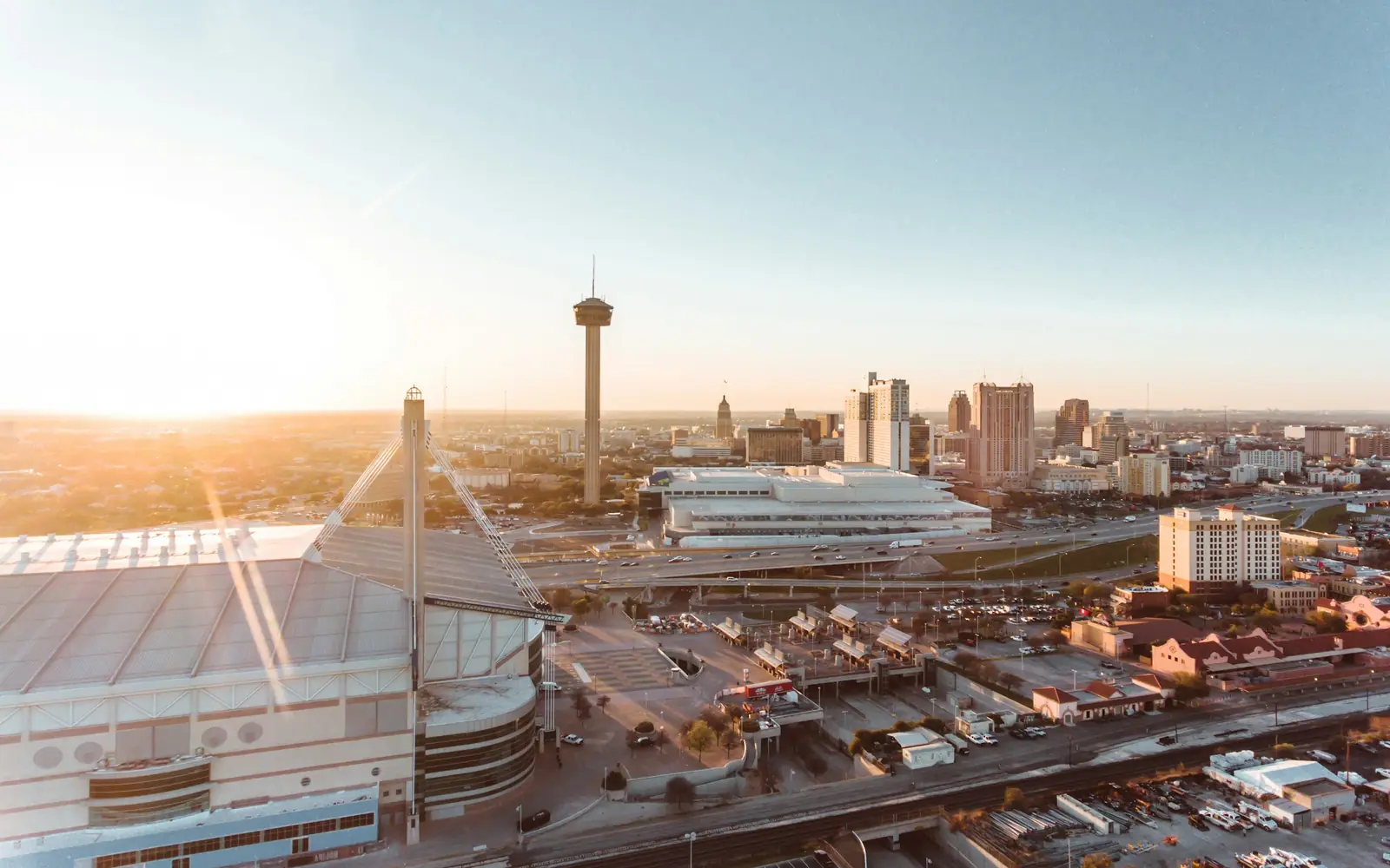San Antonio skyline with the Tower of the Americas at sunrise, seen from above